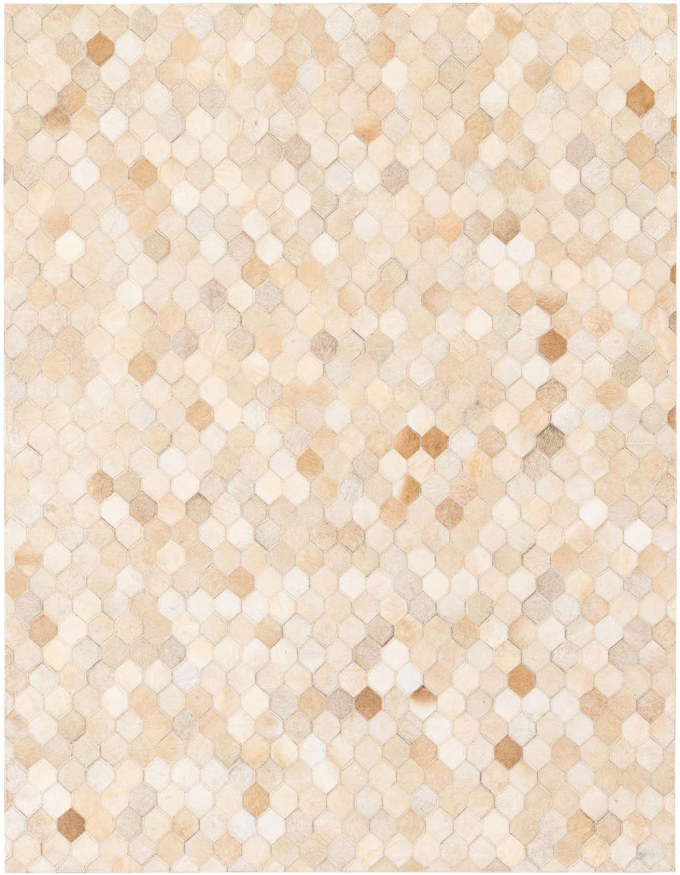 A 4x6 rectangular Cowhide Stocks rug from Rugs.com featuring a modern geometric pattern of varying brown, tan, and ivory cowhide patches.