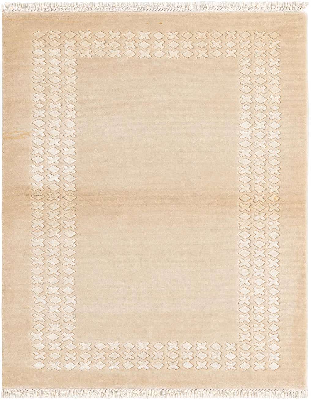 A 3x5 rectangular Darya rug in warm tan wool with a raised ivory modern geometric border pattern and fringe.
