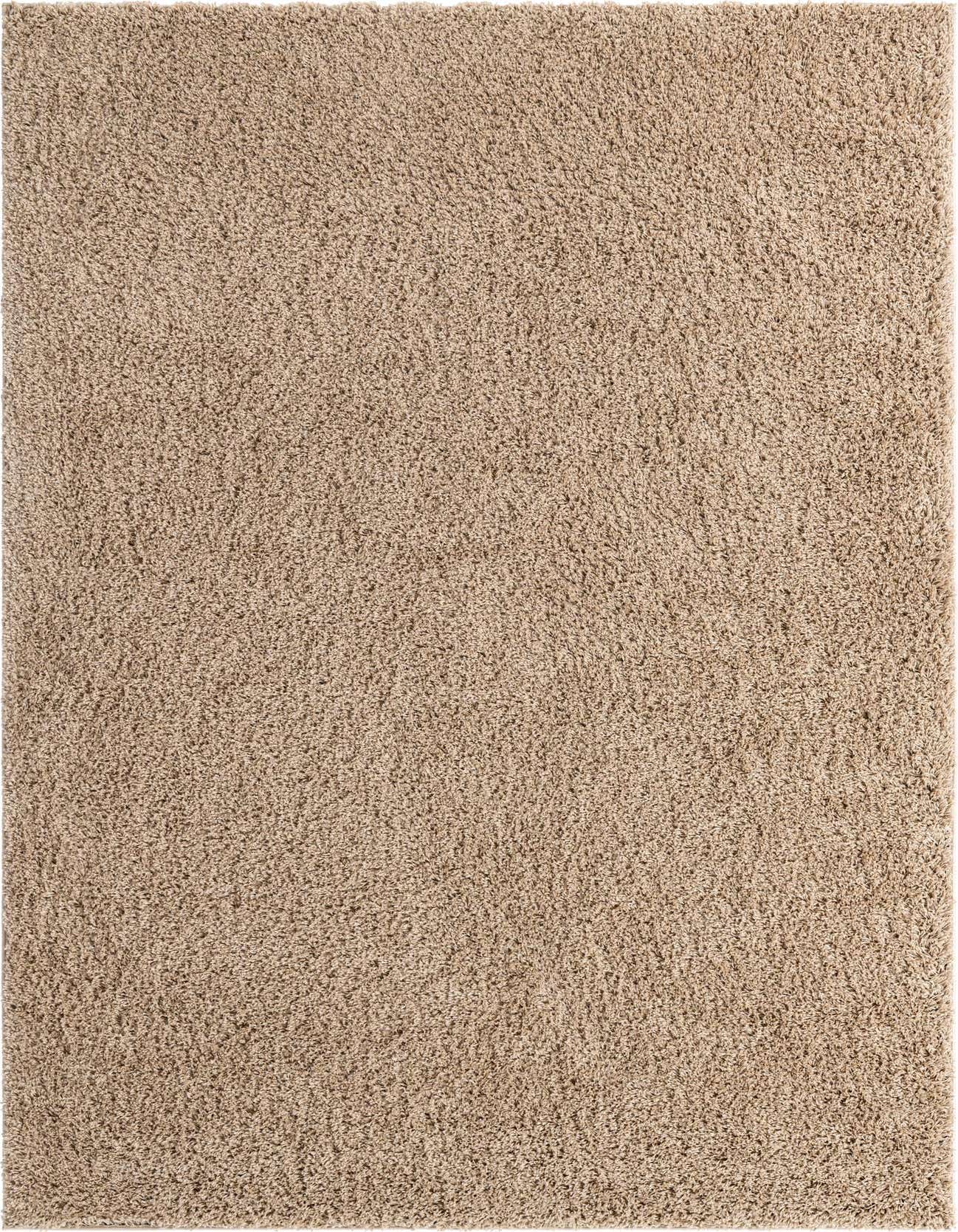 A 7x10 rectangular Everyday Shag rug in a warm tan and cream solid color, offering a plush, textured pile for indoor comfort.