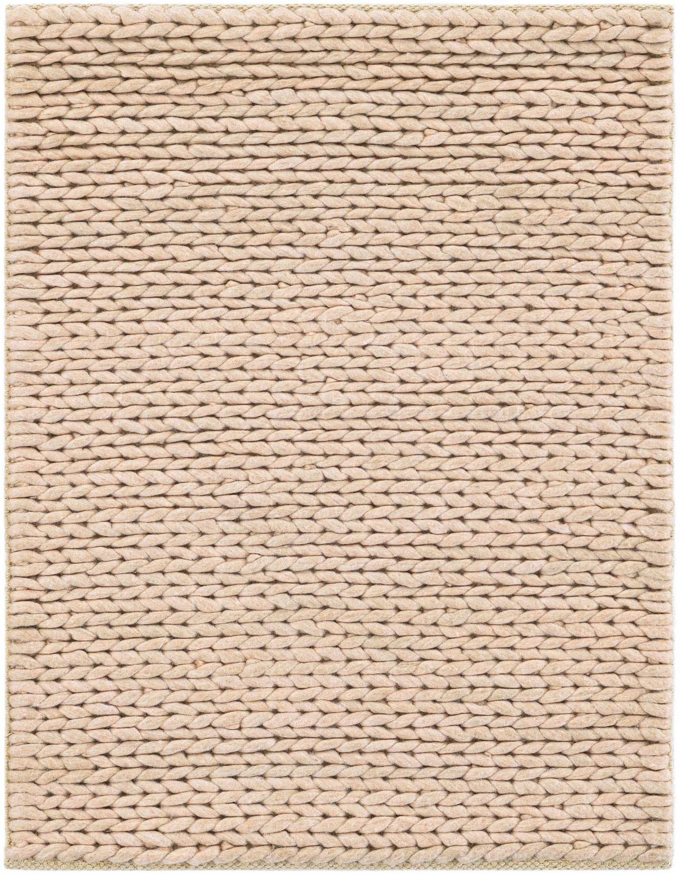 A close-up view of a 2x3 rectangular Lana New Zealand Wool rug in a solid light brown and cream color, showcasing its textured, handmade braided pile.