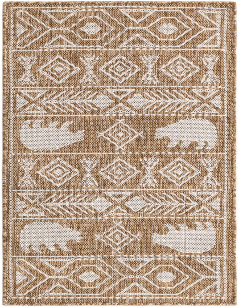 A 4 ft runner rug in browns and ivories, featuring a Southwestern tribal pattern with bear silhouettes and geometric shapes.