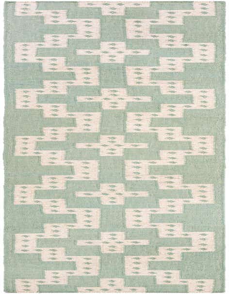 A 12 ft runner rug in light blue with an off-white tribal geometric pattern, suitable for a hallway.