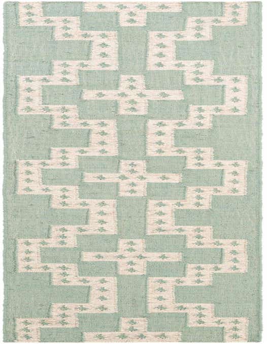 A close-up of an 8 ft runner rug featuring a tribal geometric pattern in light blue and cream, suitable for a hallway or kitchen.
