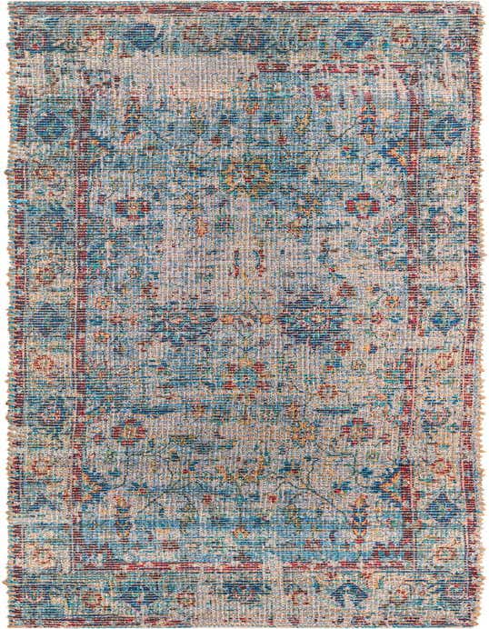 A handmade 8 ft runner rug from the Chenille Jute Collection, featuring a teal blue coastal-modern pattern with red and yellow accents.