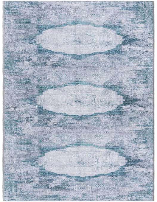A 10 ft runner rug in blues, ivories, and greens, featuring a distressed traditional medallion pattern, ideal for hallways.