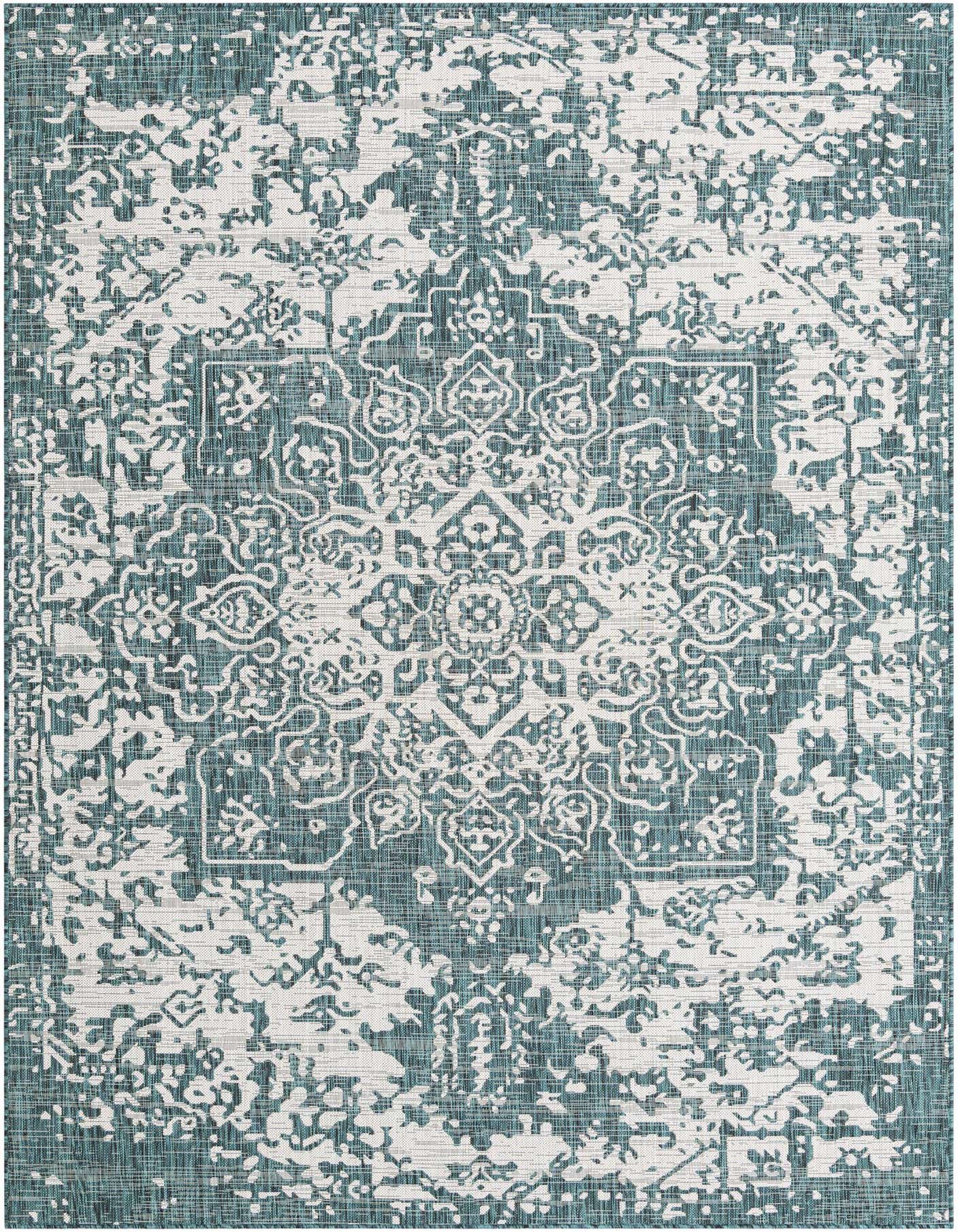 A 7x10 rectangular Jill Zarin Outdoor rug featuring a distressed blue and white Mediterranean medallion pattern.