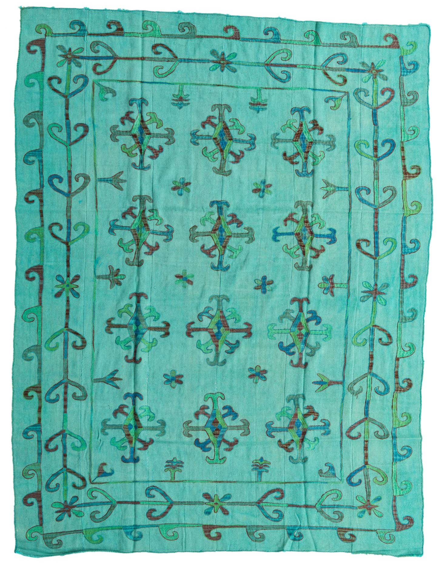 A 6x9 rectangular Kilim Suzani rug featuring a tribal pattern in shades of blue, green, and hints of brown on a light blue background.