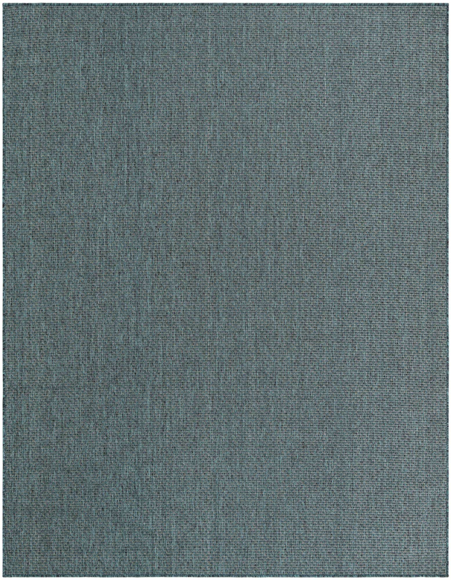 A large 8x11 rectangular indoor/outdoor rug in a deep blue-green hue with a subtle textured flatweave.
