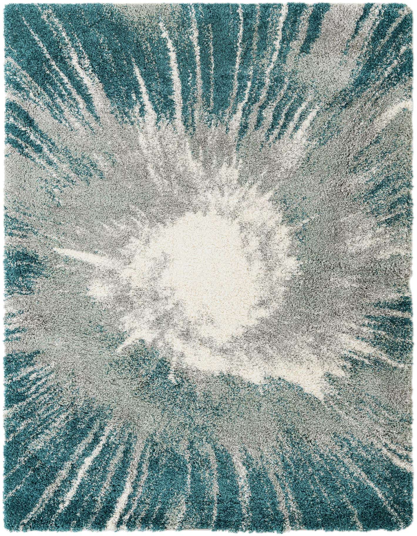 A 7x10 rectangular shag rug with a modern abstract design in shades of blue, green, grey, and white, radiating from the center.
