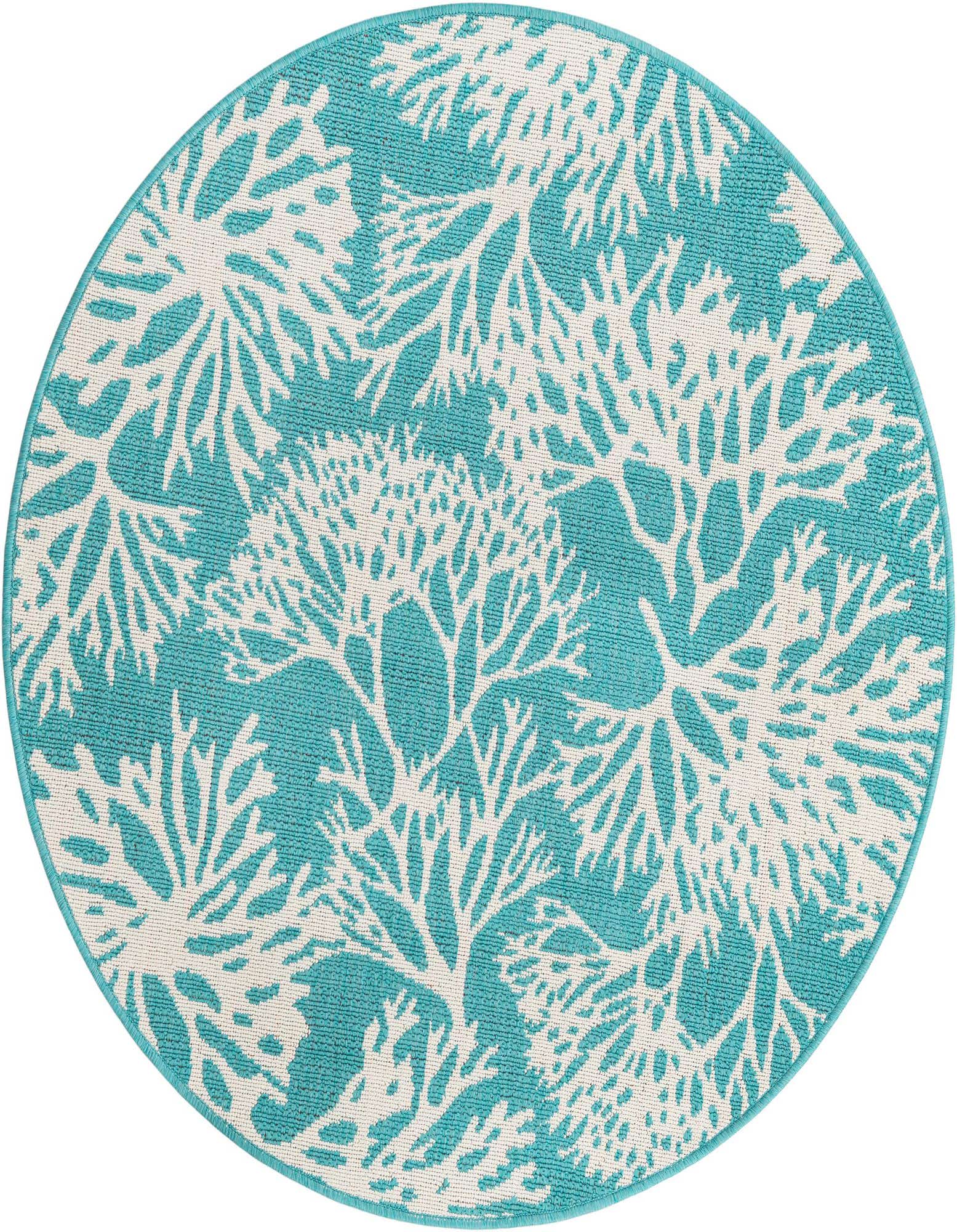 A 4' round blue and white indoor/outdoor rug with a modern coral reef pattern, perfect for a patio.