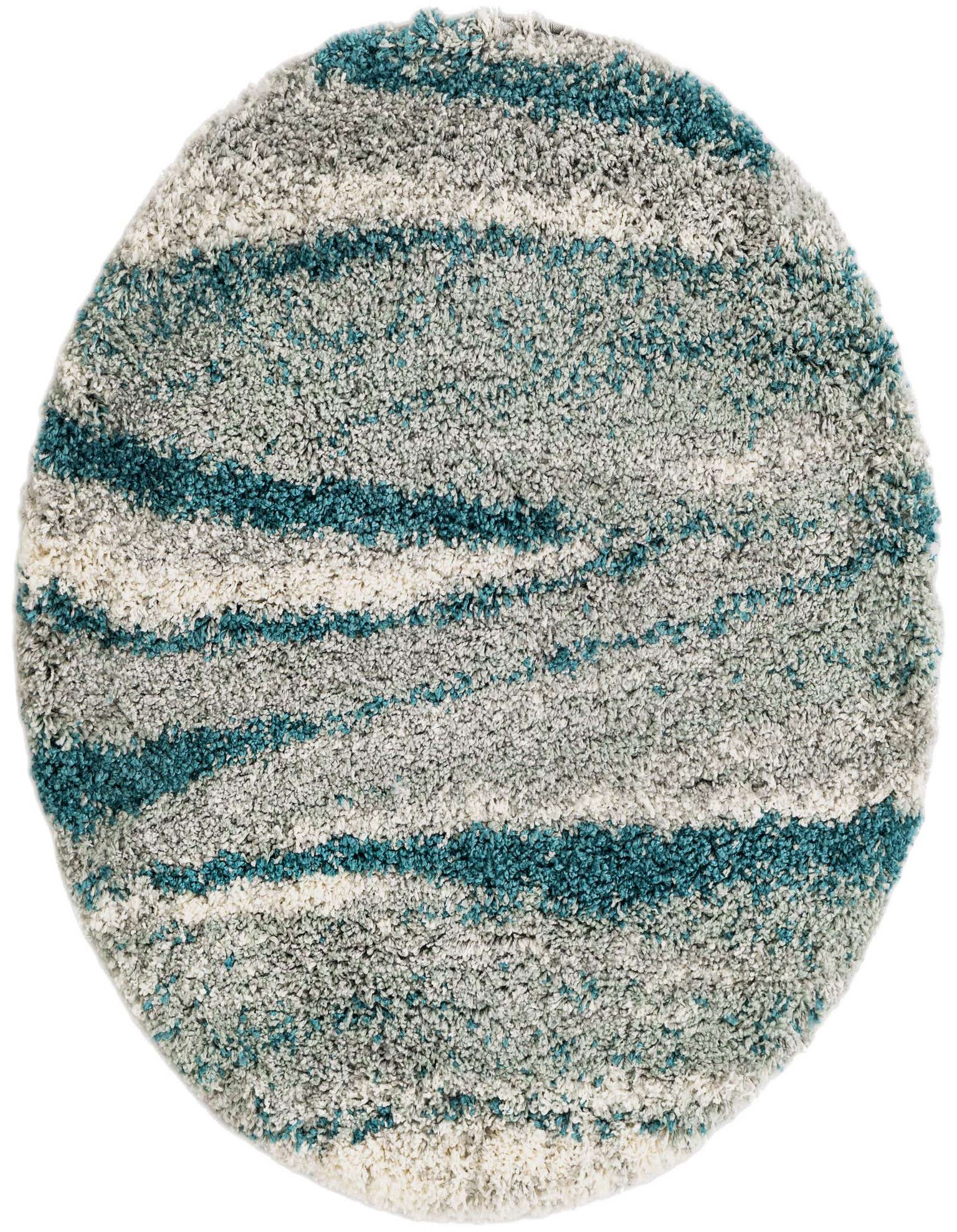 A 3' 3 x 3' 3 round shag rug featuring wavy stripes in varying shades of blue, green, and white, showcasing its modern design and plush texture.
