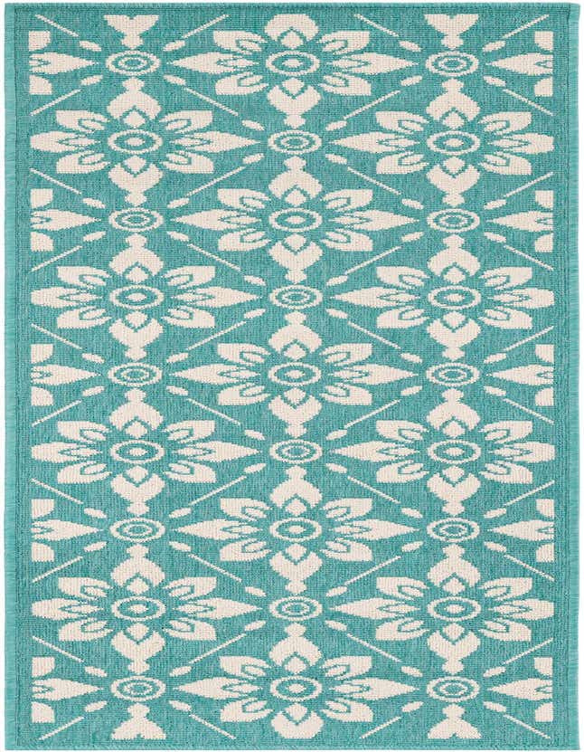 A 6 ft runner rug with a modern floral pattern in shades of blue and green, suitable for indoor or outdoor use.
