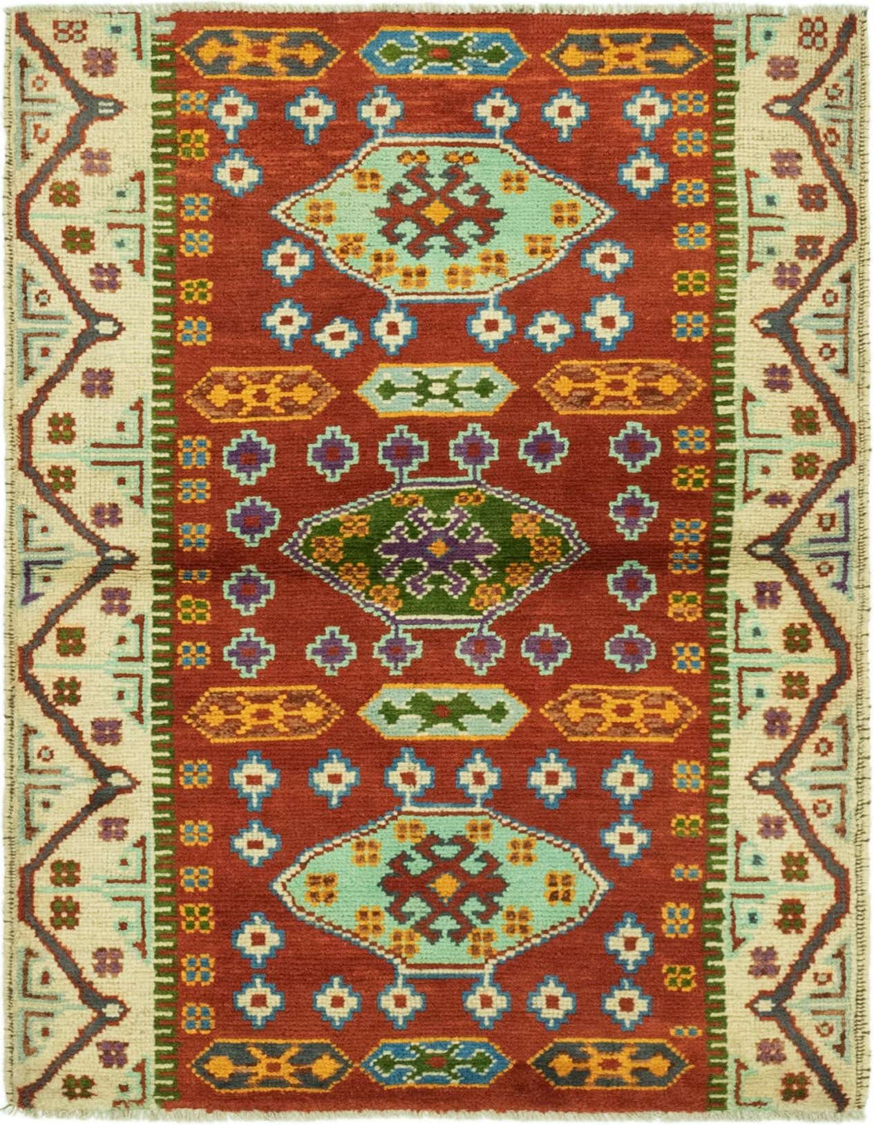 A 3x5 rectangular Balouch rug with a central medallion, featuring a rust red field, cream borders, and tribal patterns in blue, green, yellow, and purple.