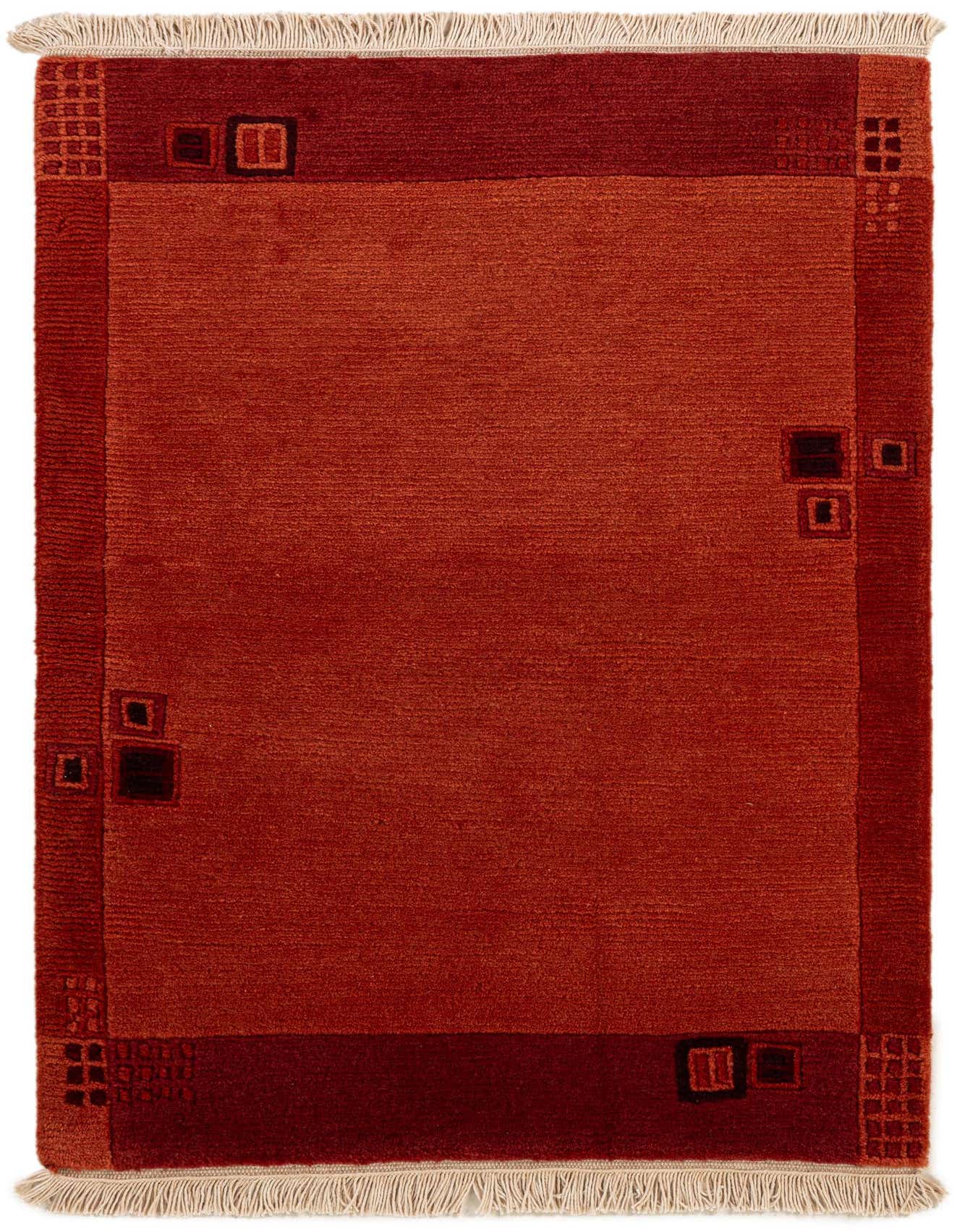 A 2x3 rectangular Nepal rug in shades of orange and red, featuring a modern Oriental pattern with geometric accents and fringe.