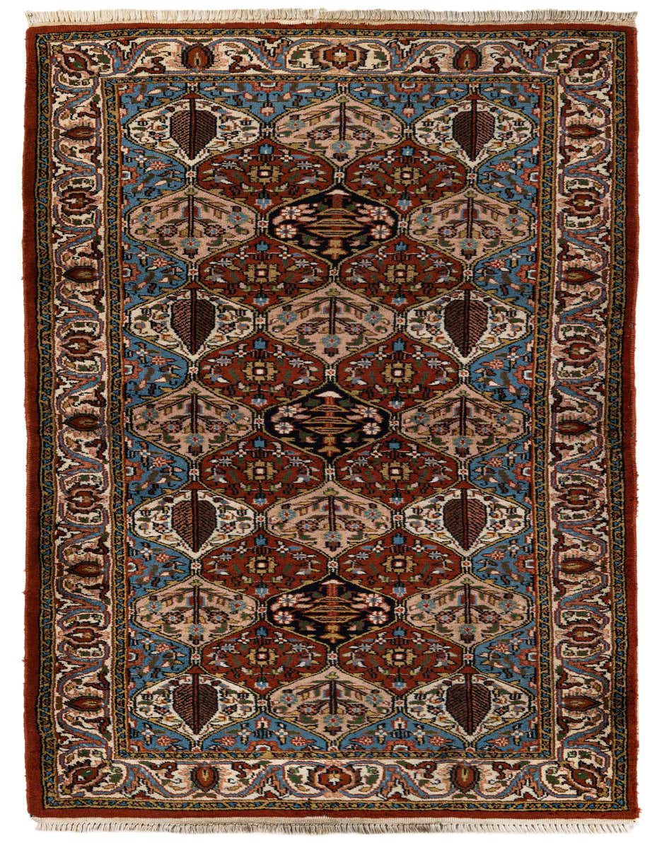A 7 ft runner rug in traditional Bakhtiar style, featuring a rich orange and red tribal pattern with blue and cream accents.