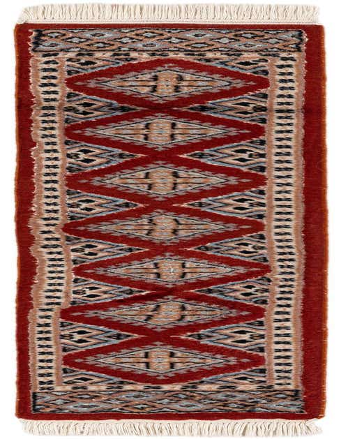 A 4 ft Bokhara runner rug with a traditional tribal pattern in oranges, reds, and creams, featuring diamond motifs and fringe.