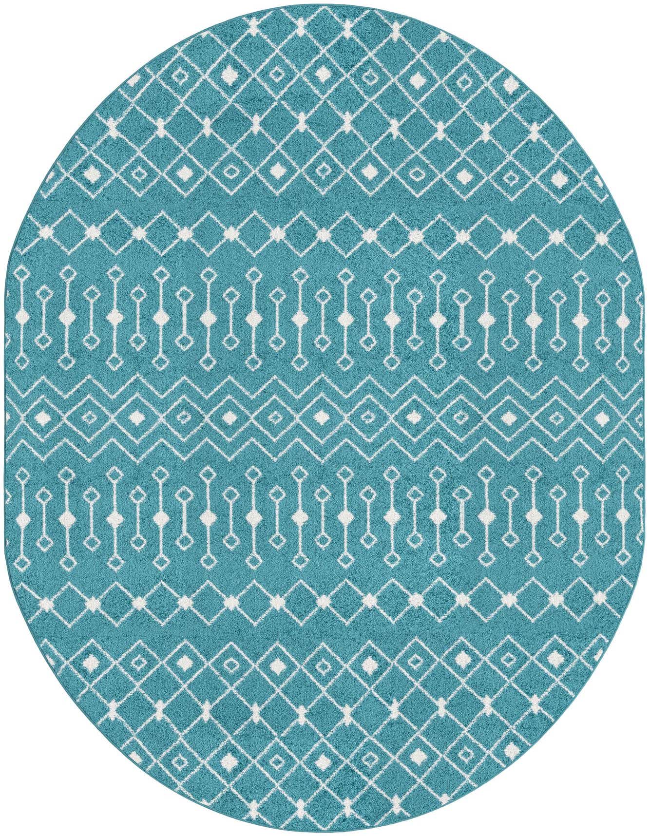 An oval blue polypropylene rug with a white bohemian trellis pattern, featuring diamond and zigzag motifs.