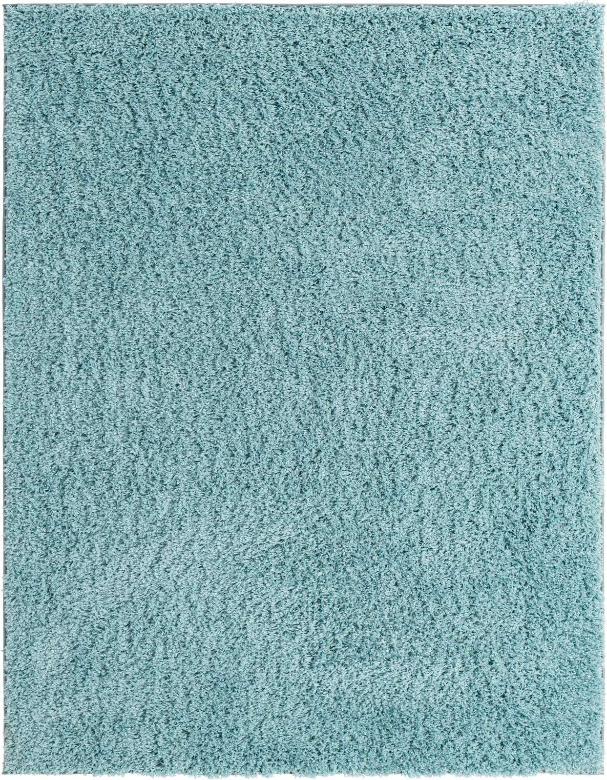 A soft, plush 5x8 rectangular shag area rug in a solid light blue color, perfect for a modern living room.
