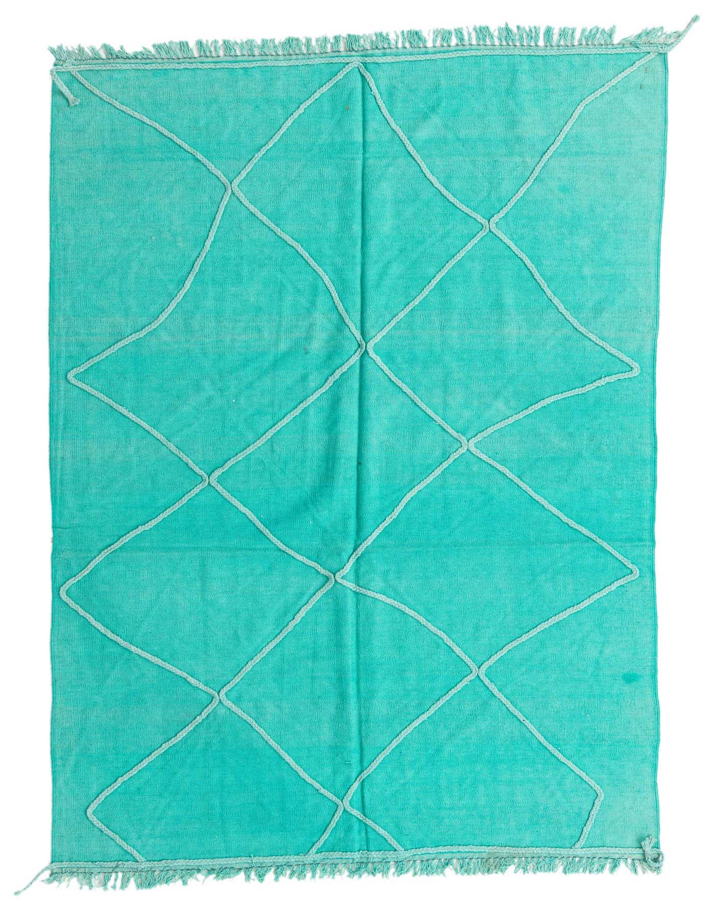 A 5x8 rectangular blue flatweave rug with a subtle light blue tribal geometric pattern and fringed ends.