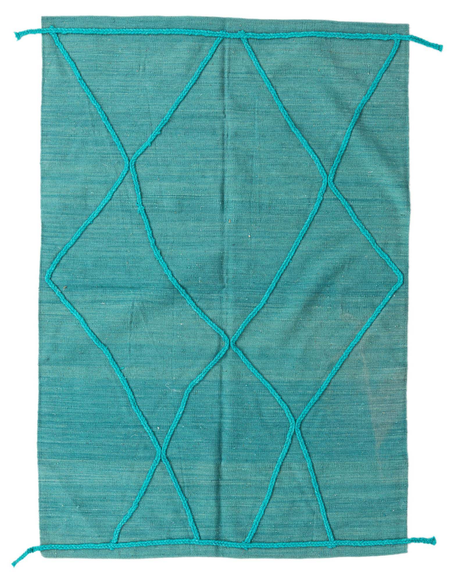 A 4x6 rectangular blue flatweave wool rug with a modern tribal diamond pattern in a lighter blue.