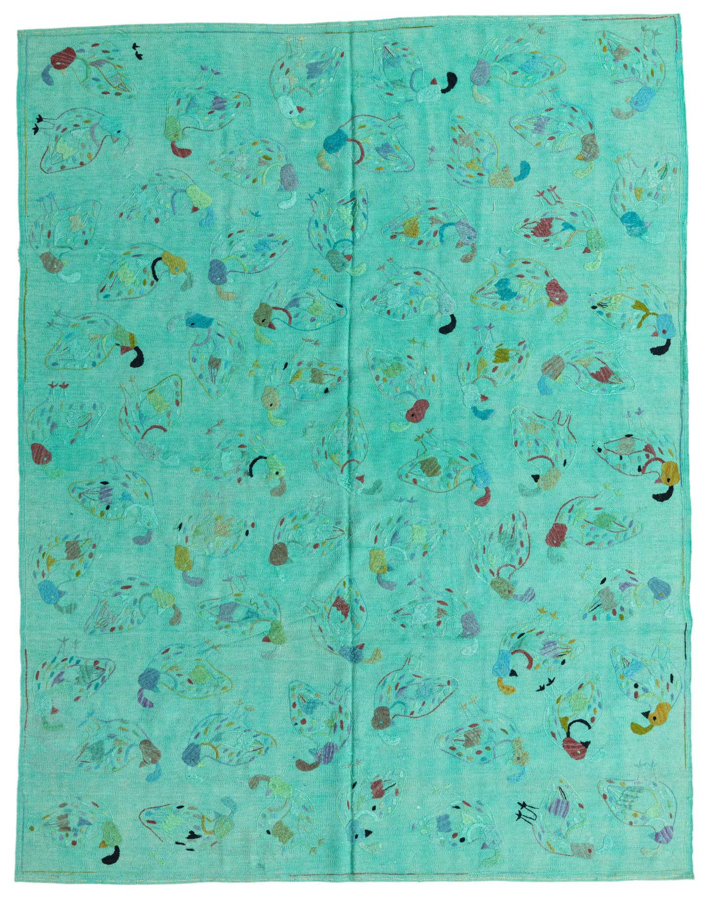 A 6x9 rectangular Kilim Suzani rug in light blue with colorful tribal and oriental patterns, suitable for a living room.