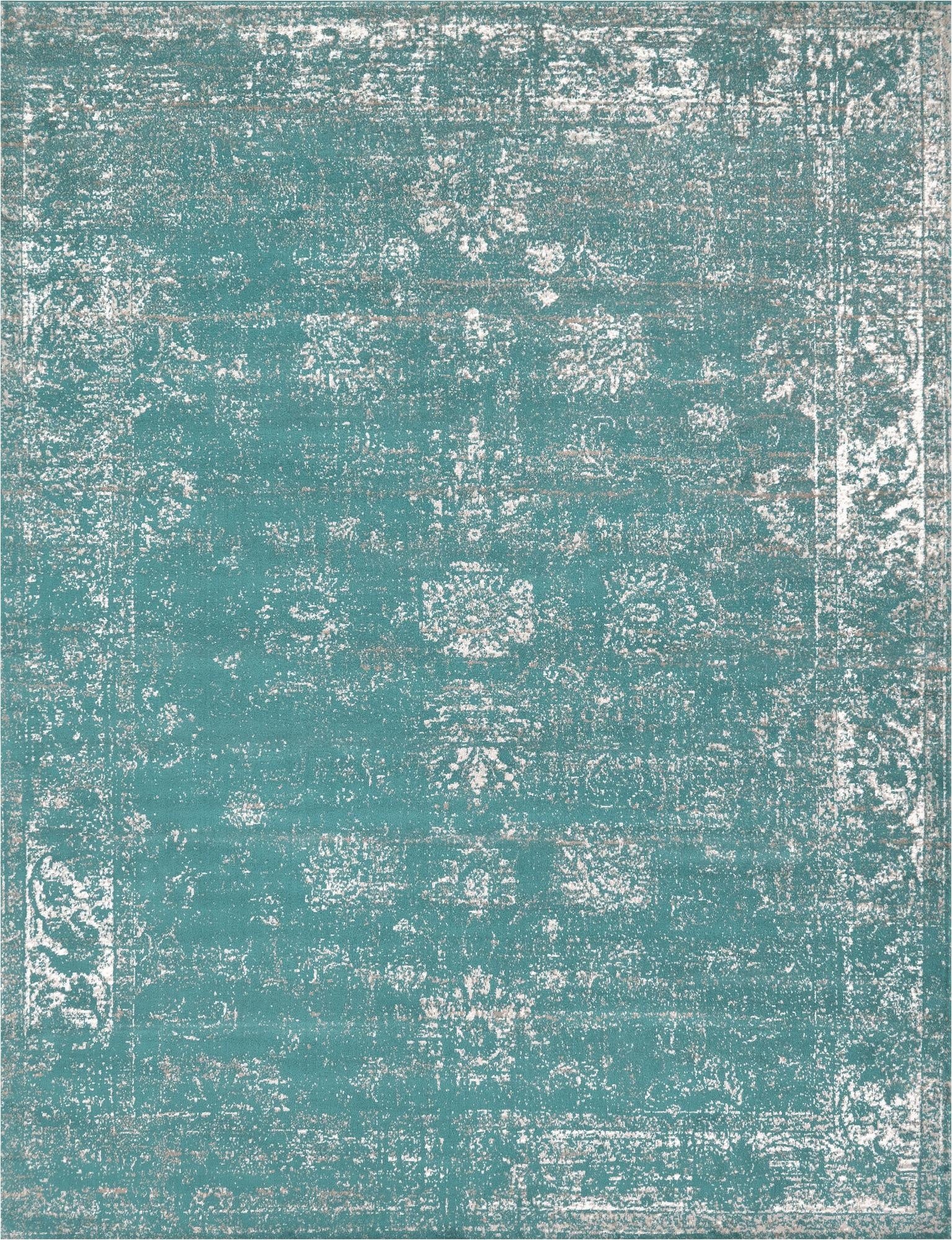 A 9x12 rectangular Monte Carlo rug in varying shades of blue with a distressed bohemian medallion pattern.