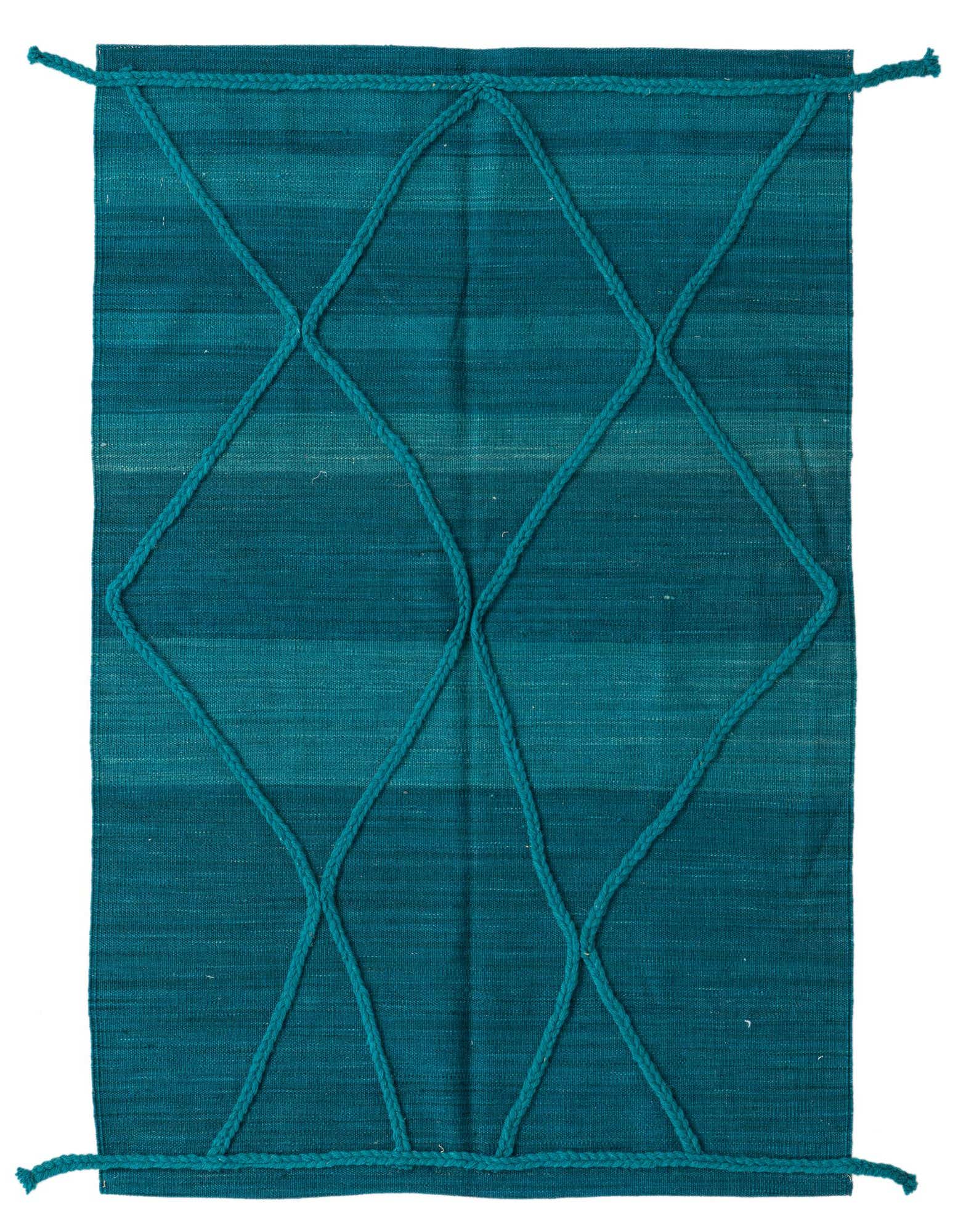 A 3x5 rectangular blue wool shag rug with a modern tribal diamond pattern made of braided ropes.