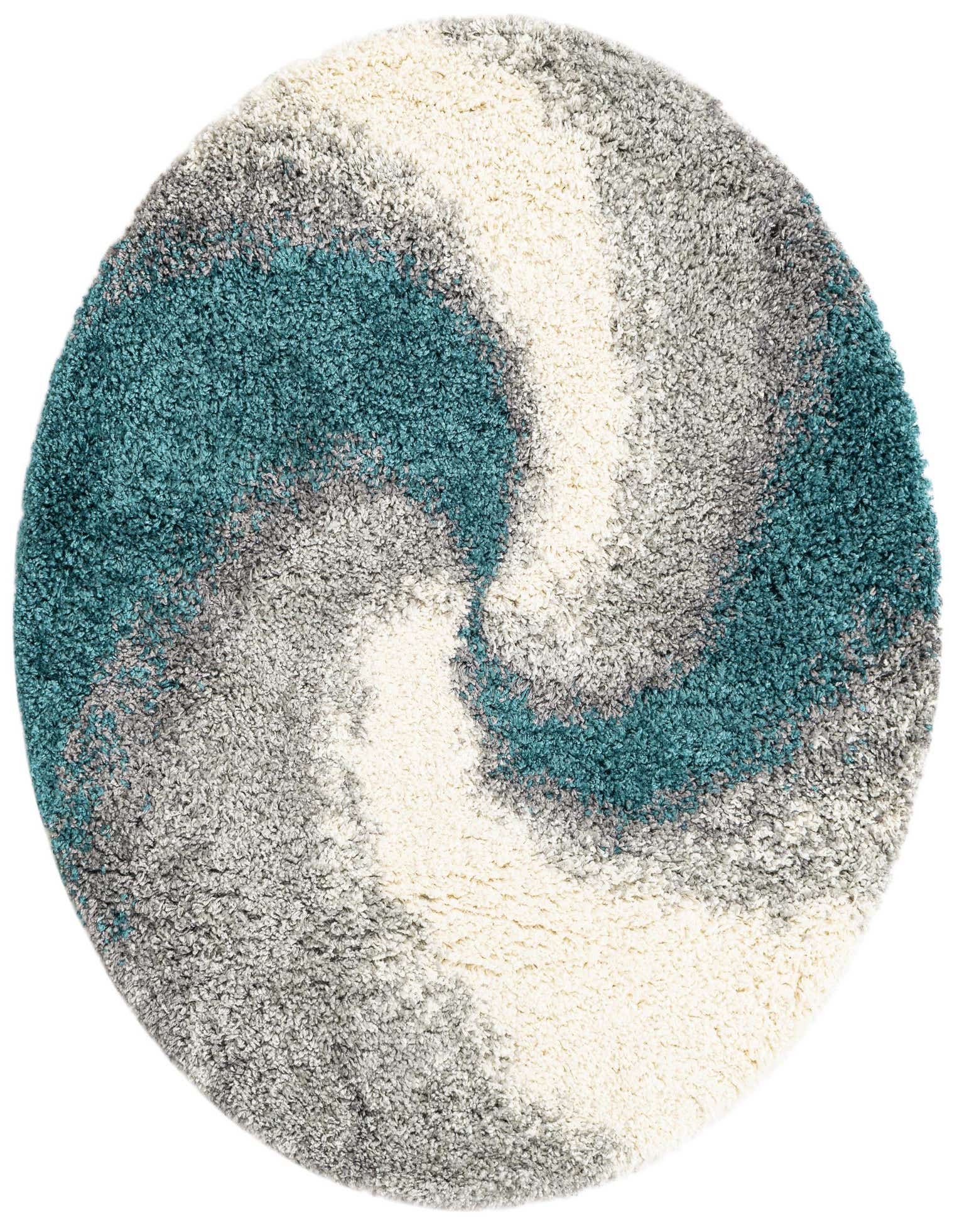 A round, shag rug with an abstract swirl pattern in shades of teal blue, light grey, dark grey, and cream.
