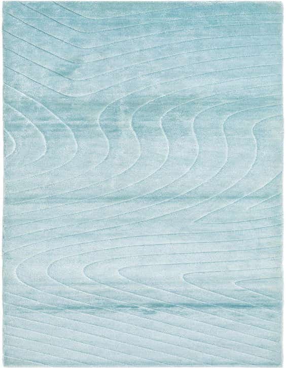 A 10 ft Darya runner rug in light blue wool with a modern, wavy pattern, ideal for a hallway.