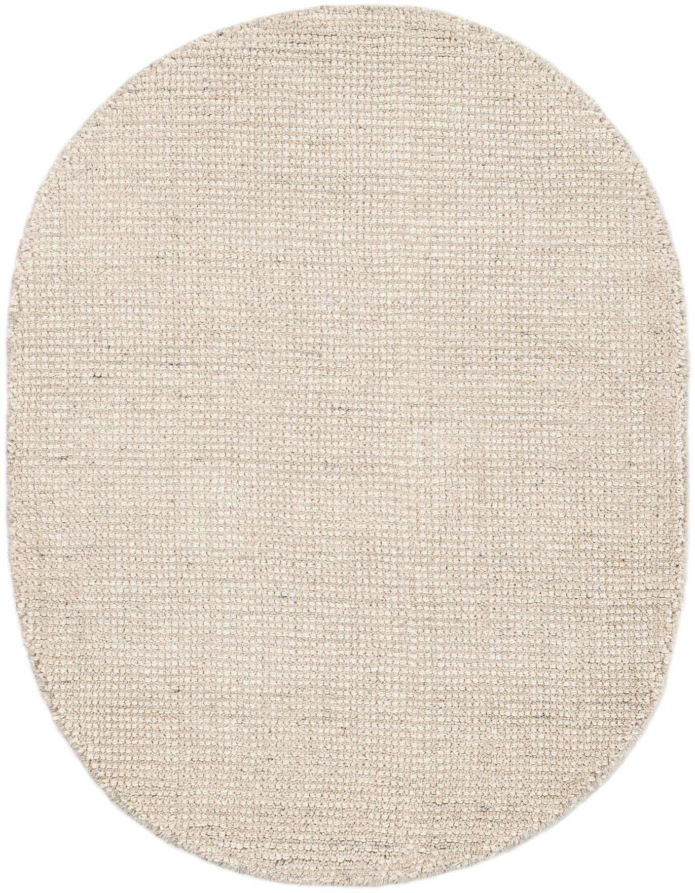 A 2' x 3'1 oval Jill Zarin English Manor rug in varied shades of cream, tan, and ivory, featuring a textured, high pile, handmade from wool.