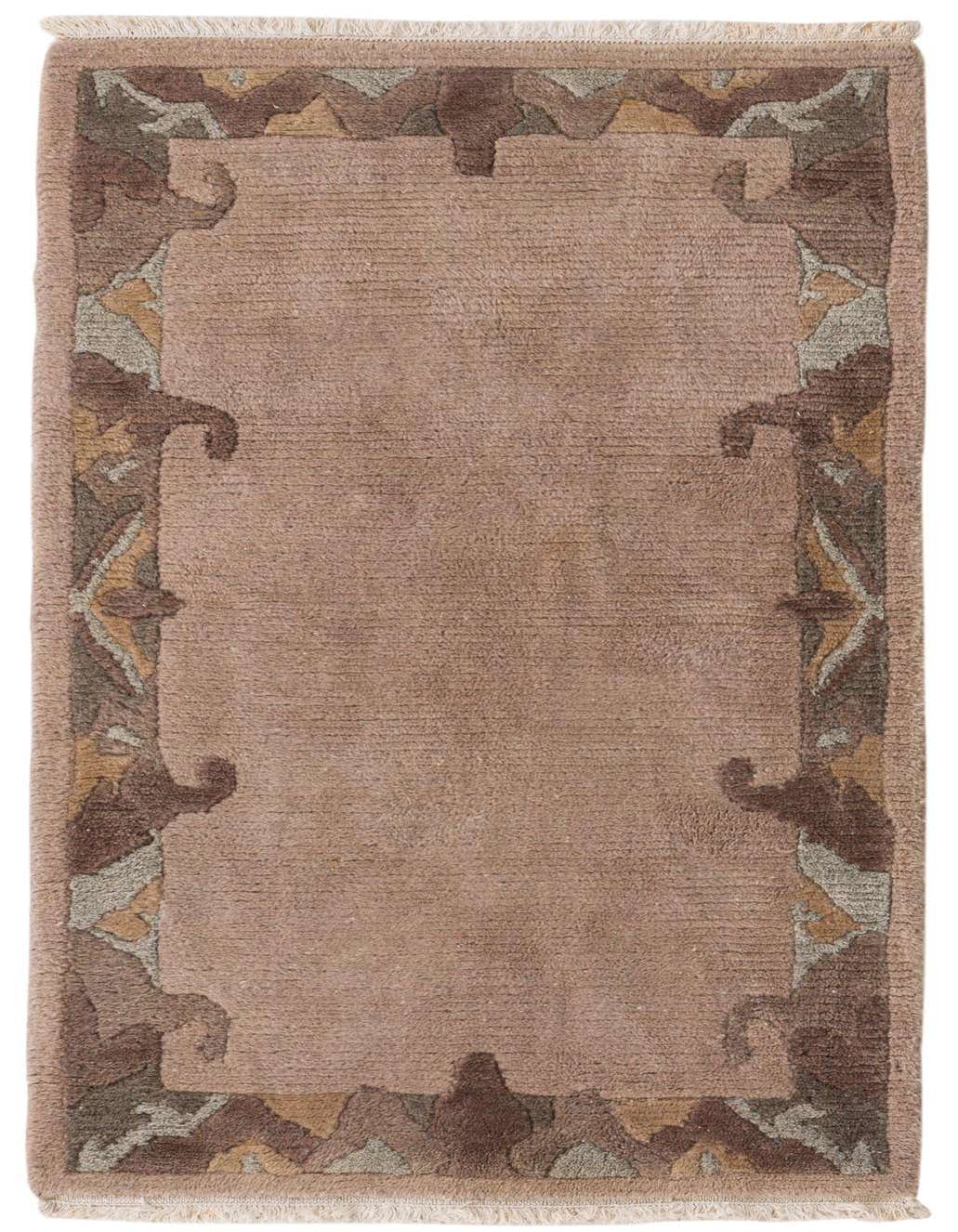 A 3x5 rectangular pink wool rug with a high pile and an abstract oriental border in shades of red, brown, and beige.