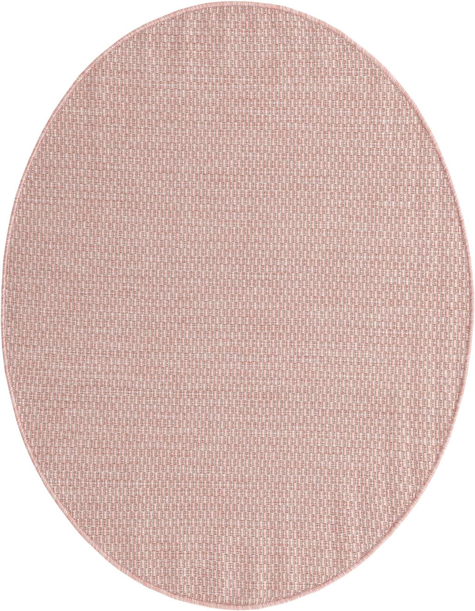 A 4' round pink flatweave rug with a subtle textured pattern, suitable for indoor or outdoor use.