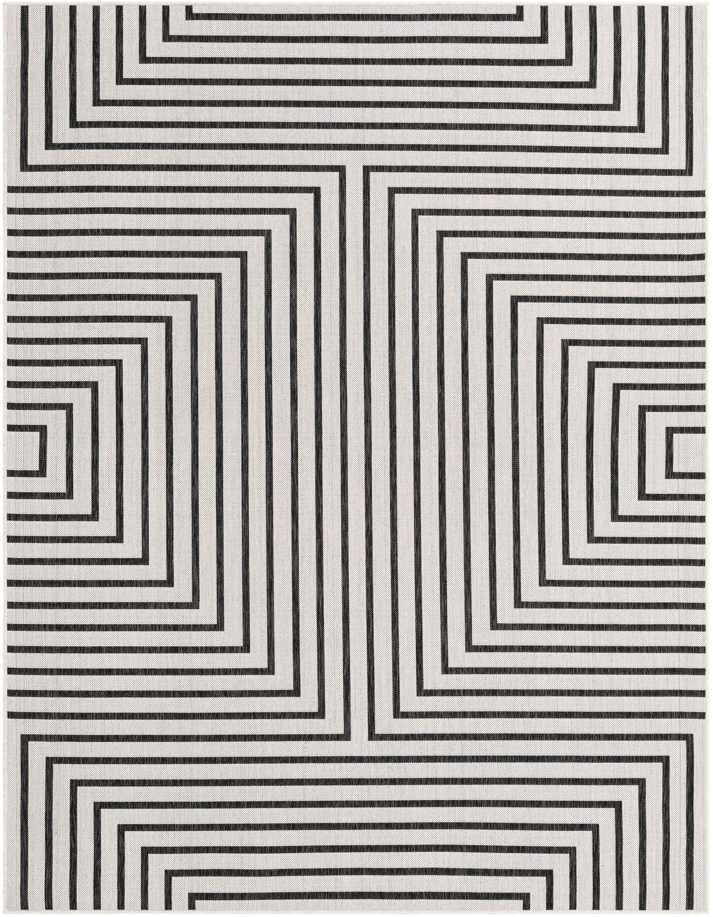 A 7x10 rectangular black and white contemporary rug with a bold geometric stripe pattern, ideal for indoor or outdoor spaces.