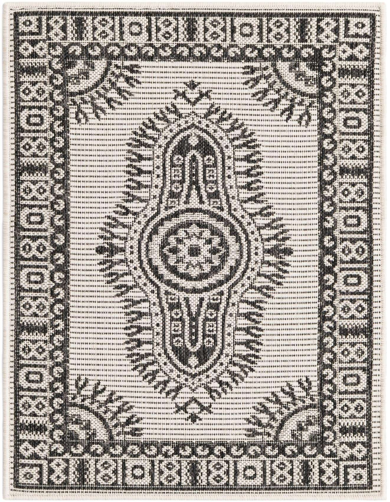 A 2x3 rectangular black and ivory flatweave rug with a traditional medallion pattern and decorative border.