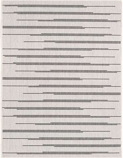 A 12 ft runner rug featuring a minimalist pattern of horizontal black stripes on an ivory and white textured background, suitable for a hallway or patio.
