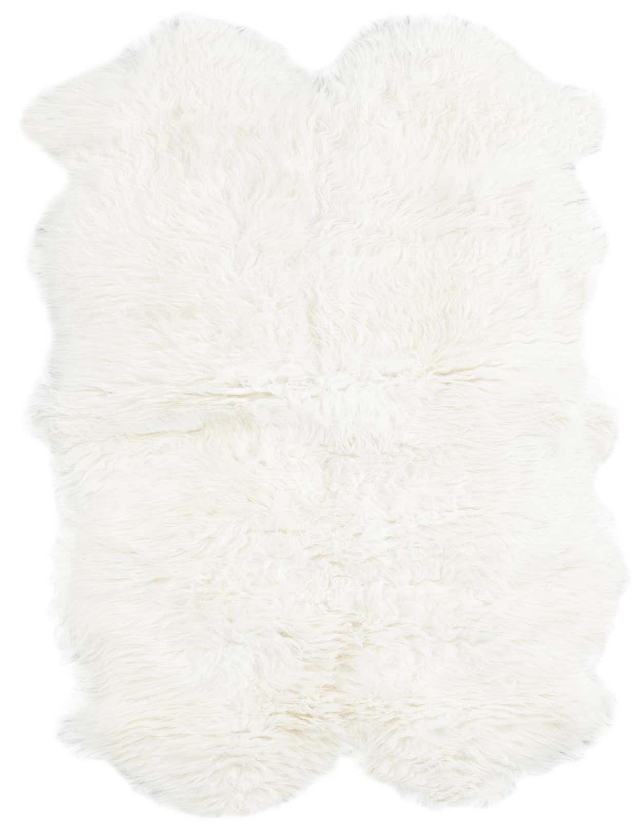 A plush, soft white 3' 3 x 6' 0 freeform lambskin rug with a medium pile, perfect for adding warmth.