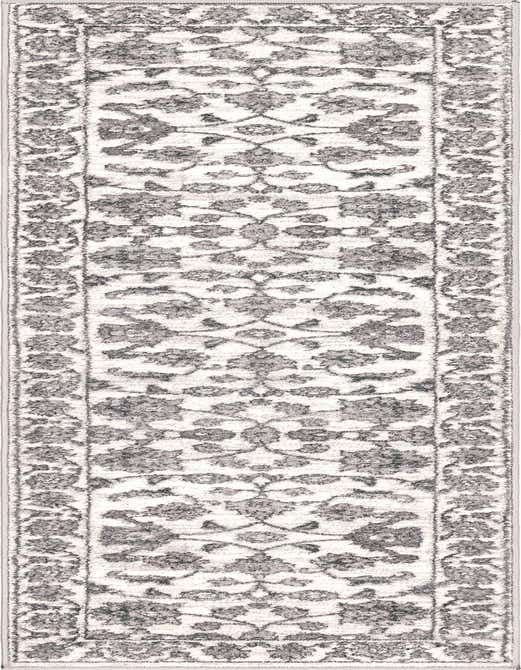 White and gray 8 ft runner rug with a traditional botanical pattern and a textured pile, perfect for a hallway.