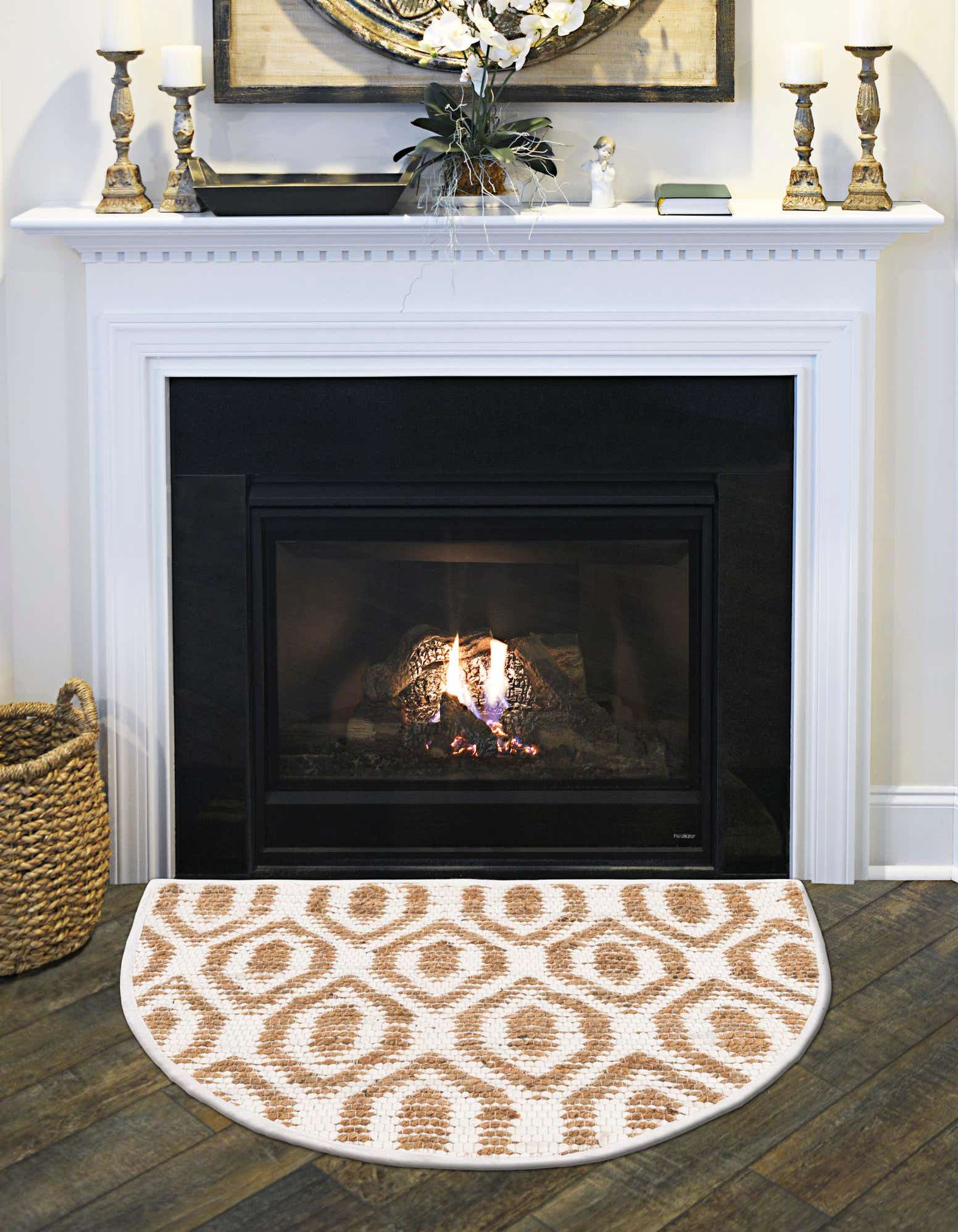 A 2' 2 x 3' 7 hearth-shaped rug with a natural jute and white denim cotton geometric pattern, ideal for a fireplace or entryway.