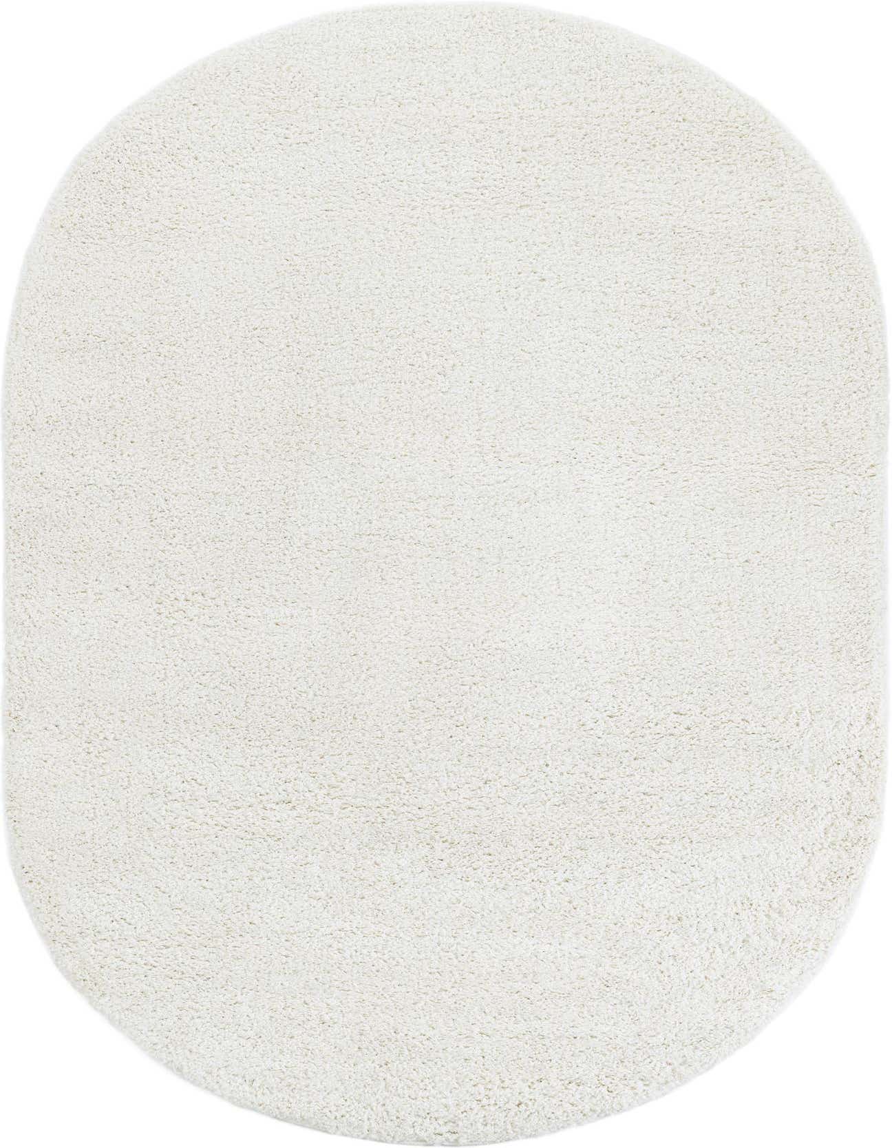 A soft, plush 5' 3 x 8' 0 oval white shag rug, perfect for adding cozy texture to any indoor space.