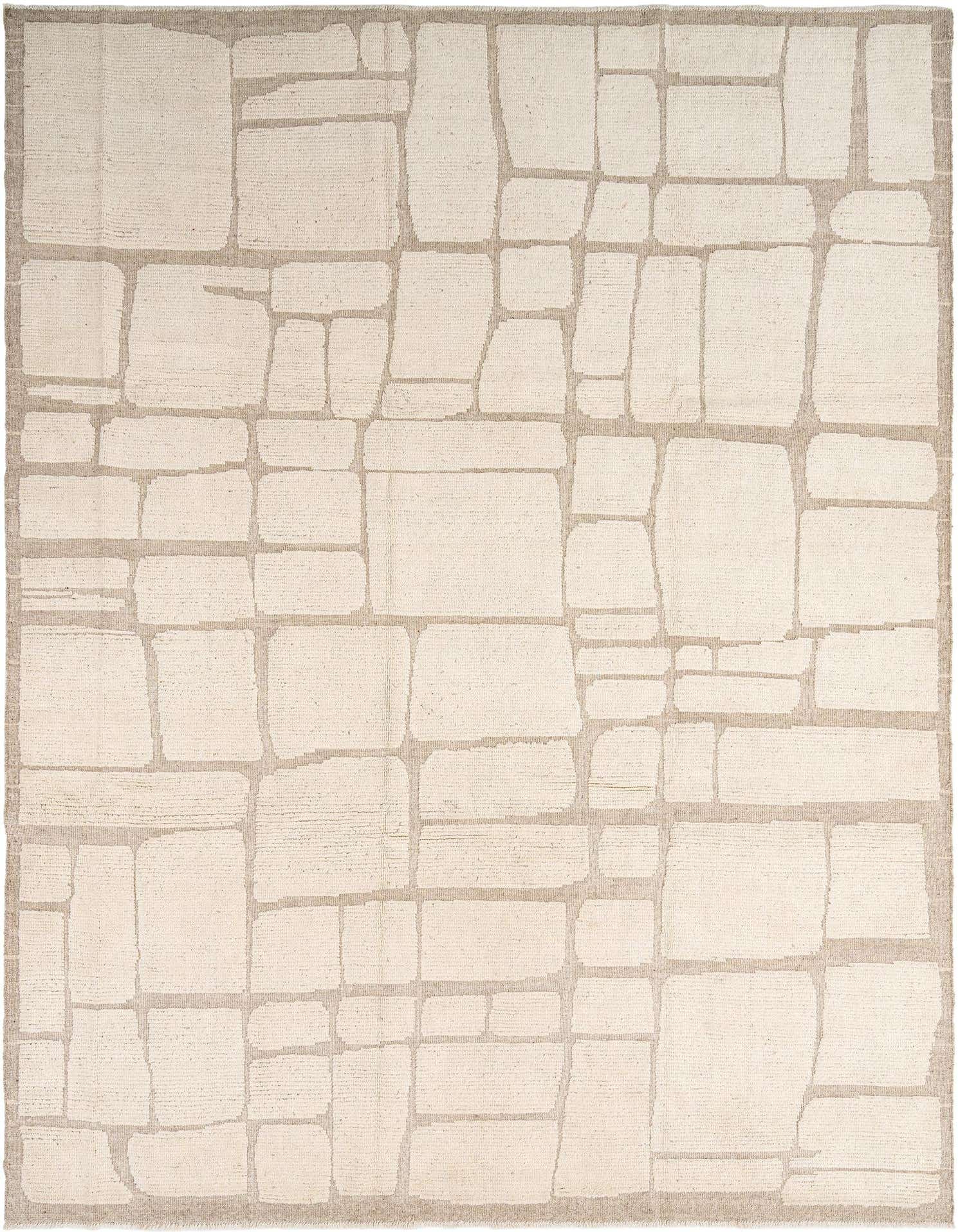 A rectangular Beni Marok wool rug in shades of white and beige, featuring a modern abstract geometric pattern resembling irregular stone blocks.