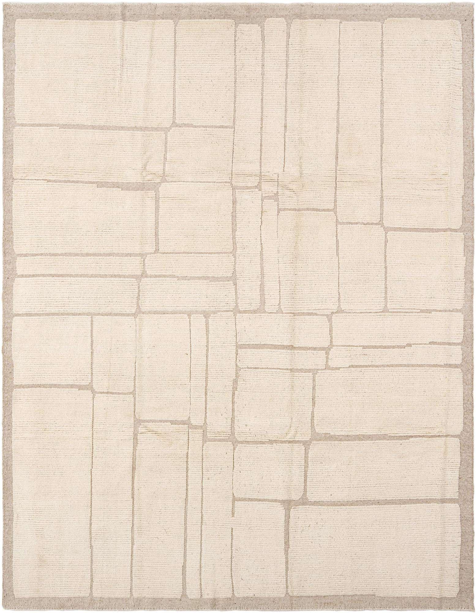 A rectangular handmade wool rug featuring a modern abstract geometric pattern in shades of white and light beige.