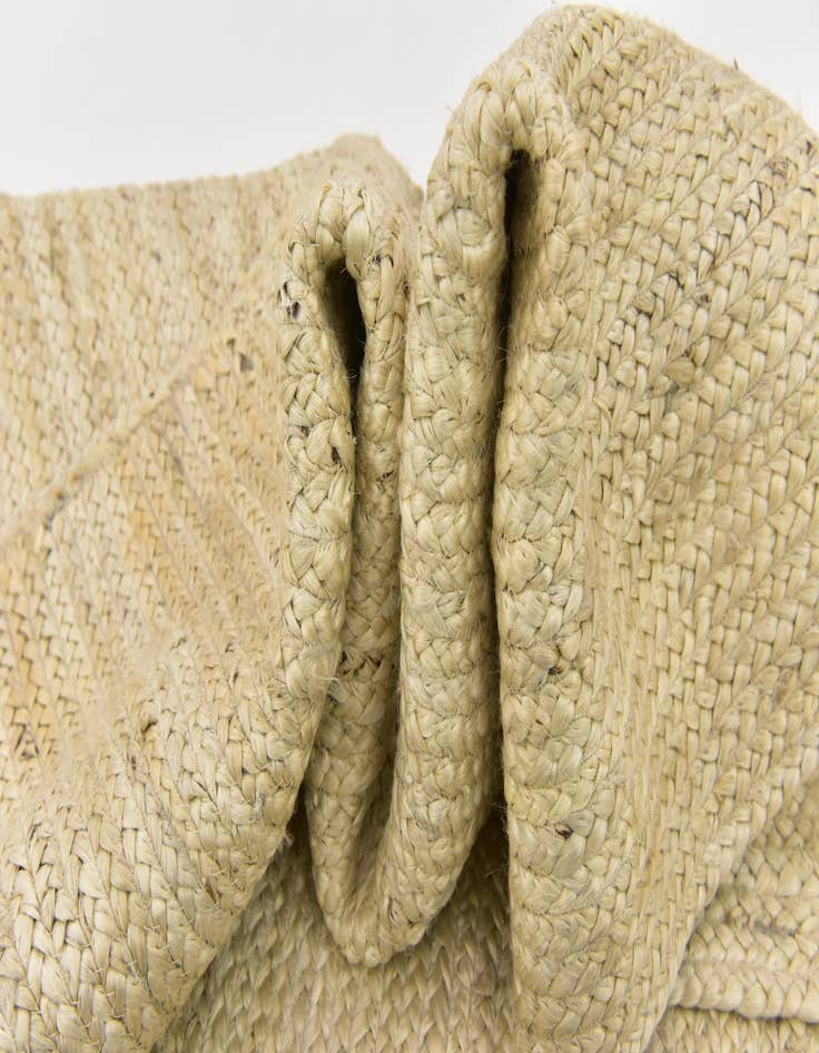 Detail image of  5' 1 x 8'  Hand Braided Jute Rug
