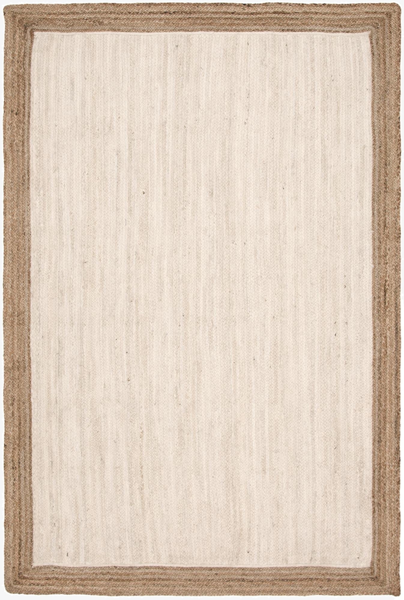 A 6x9 rectangular white jute rug with a natural braided border, perfect for a living room.