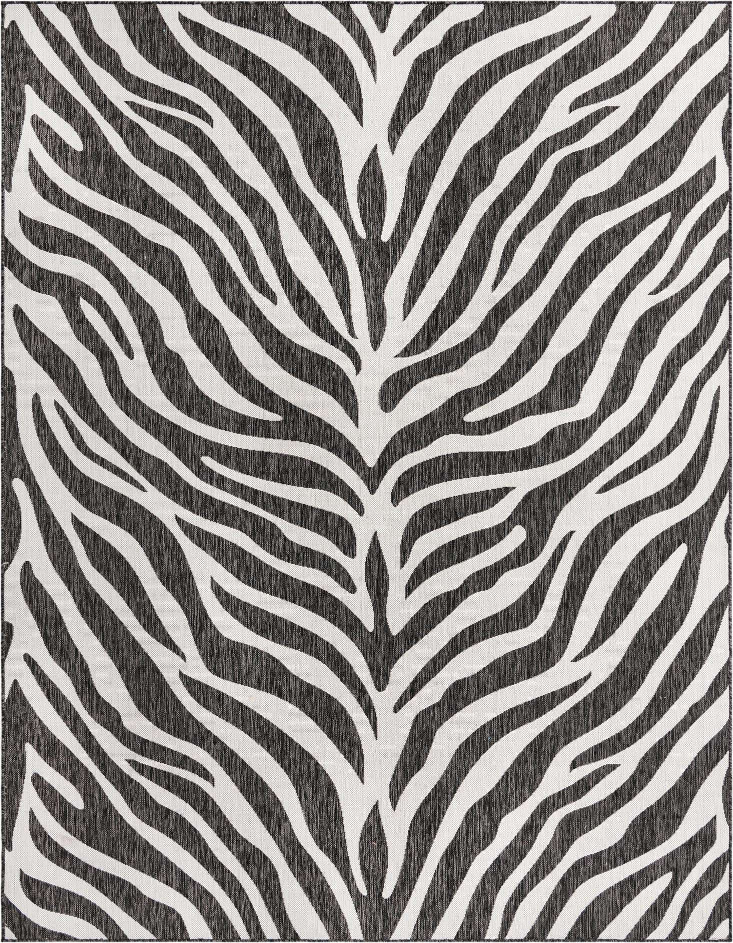 A rectangular 8x11 indoor/outdoor rug with a modern zebra stripe pattern in black and white, suitable for a patio or living room.