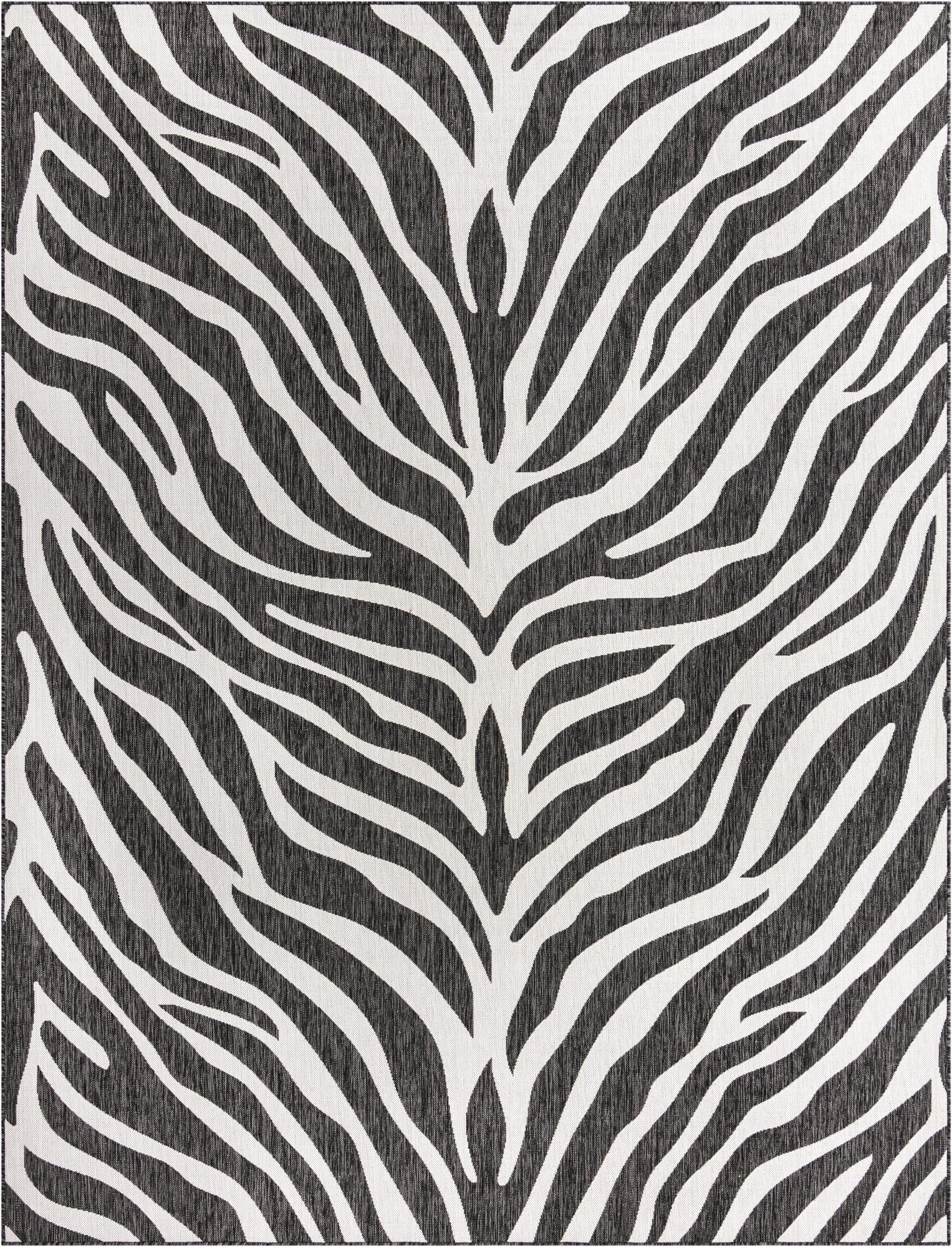 A 9x12 rectangular indoor/outdoor rug featuring a bold black and white zebra stripe pattern.