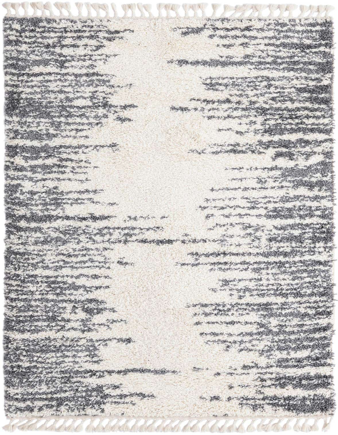 A 5x8 rectangular white shag rug with a textured, abstract gray pattern and decorative tassels on the ends.