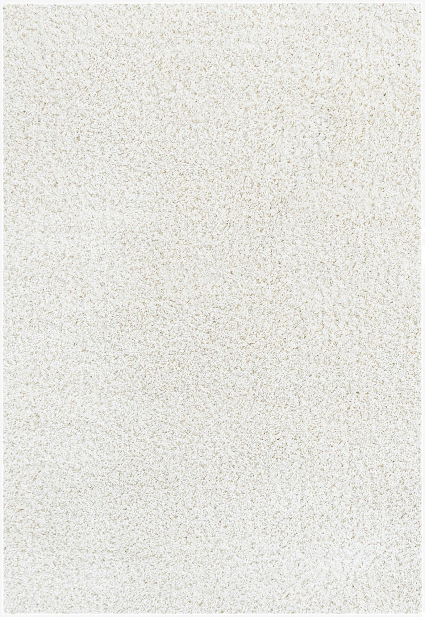 A close-up view of a soft, plush 2x3 rectangular white shag rug, showcasing its textured pile.