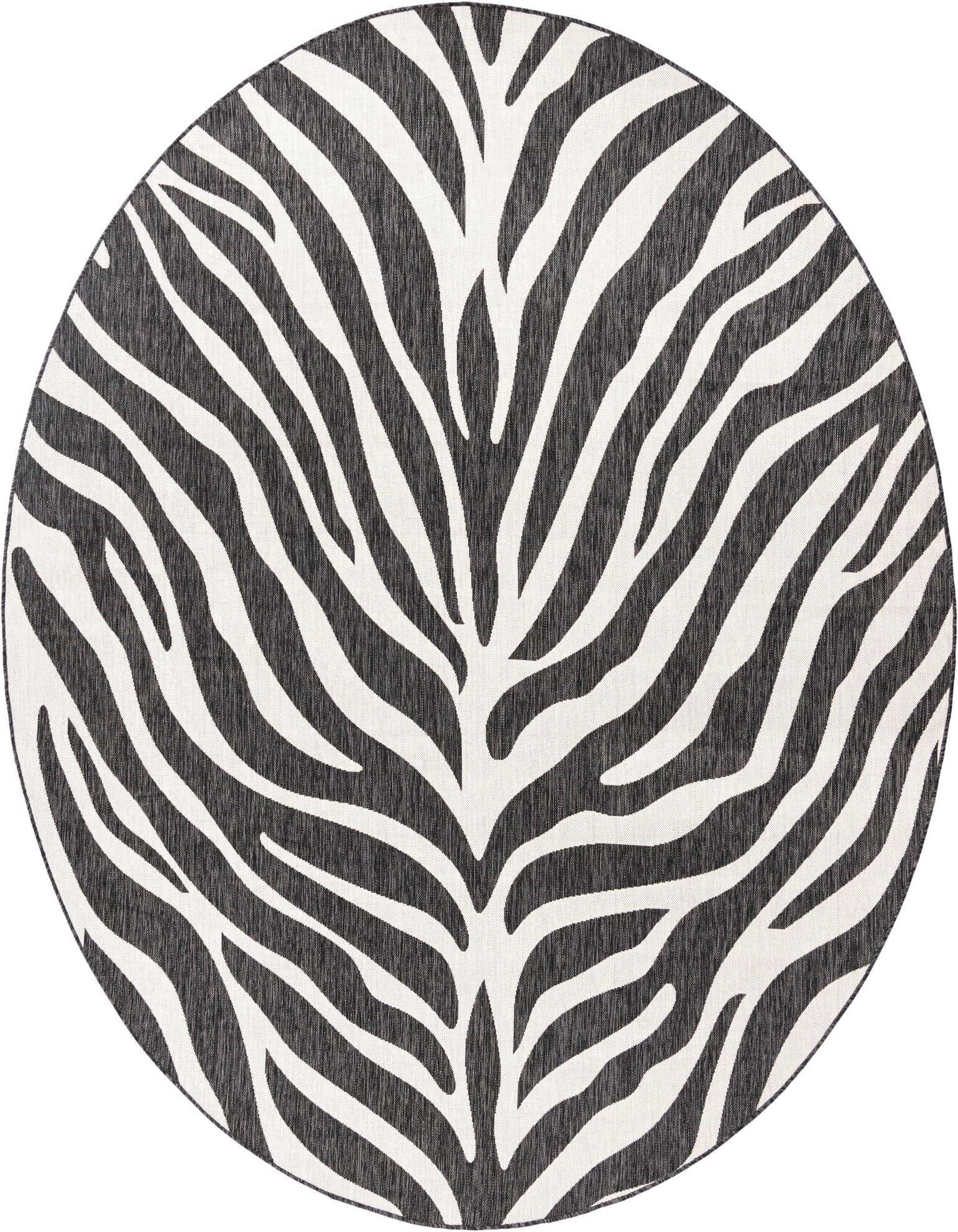 A 10' round black and white zebra print rug, featuring bold stripes, suitable for a patio.
