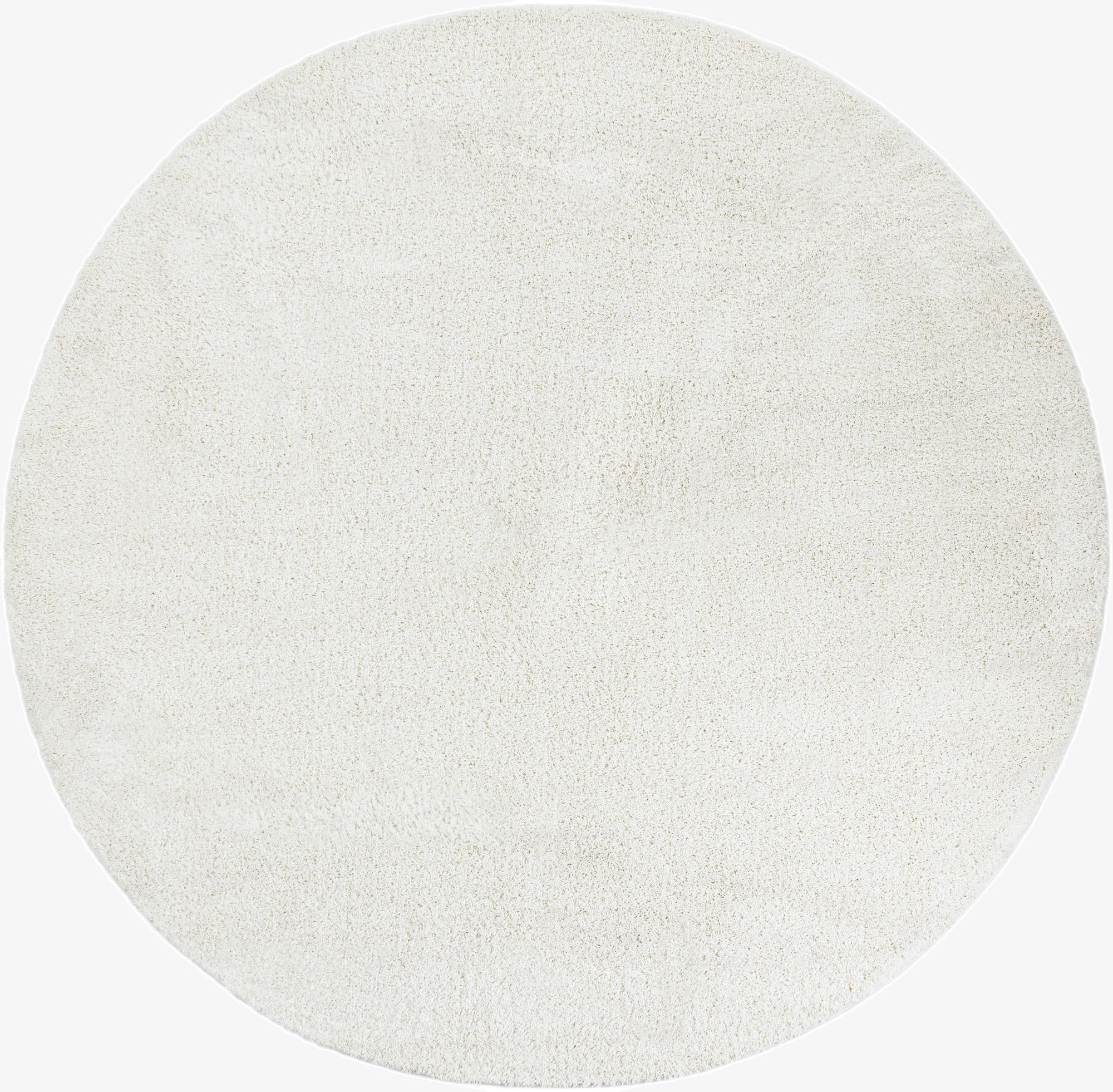 A large 10' round white shag rug made of polypropylene, featuring a soft, textured pile.