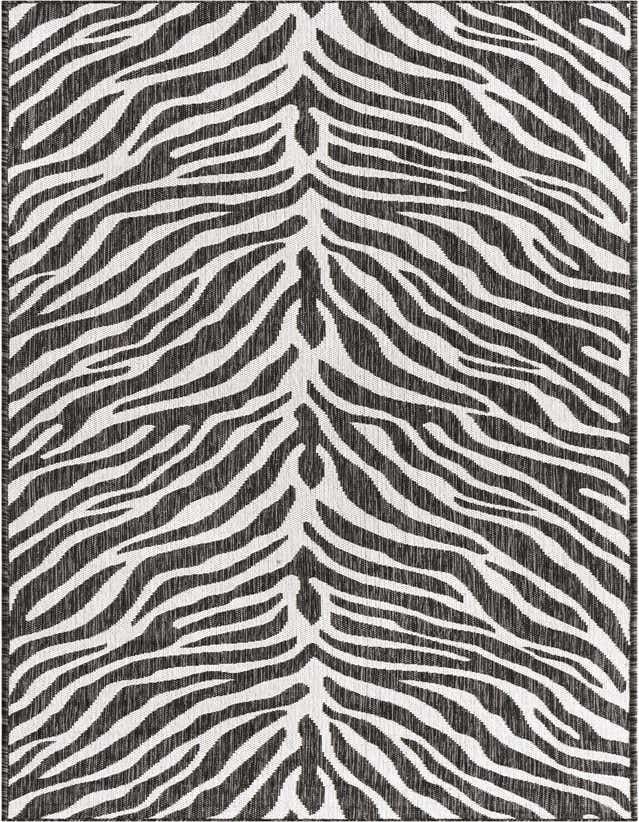 A 10 ft runner rug featuring a striking black and white zebra stripe pattern, ideal for a hallway or patio.